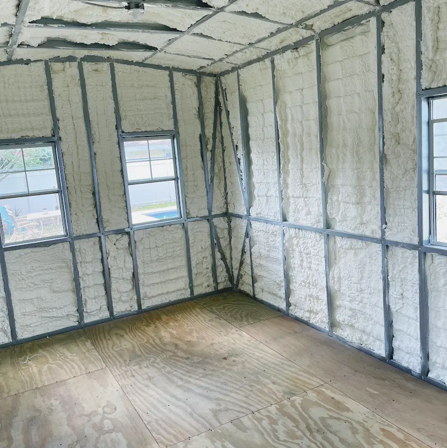 Closed-cell spray foam insulation applied to wall cavities in a residential project in Westchase